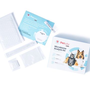 A closed comprehensive microbiome analysis testing kit from Petivity, with the contents of the testing kit laid out next to the box.